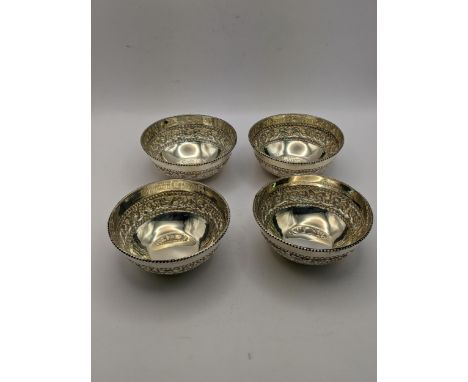 Four silver bowls, stamped silver to be bottom having embossed engraved decoration, total weight 242.6gLocation: 