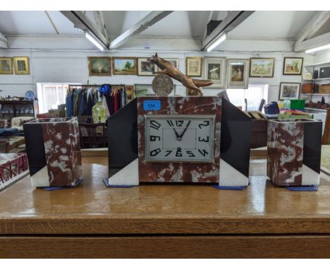 A French Art Deco marble mantel clock, garniture with a leaping fox, the eight hour movement faced by a square Arabic dialLoc