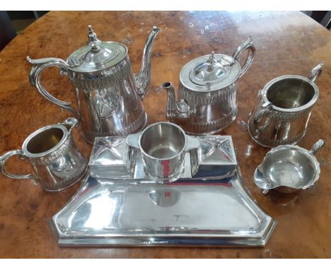 Early 20th century silver plate to include a desk tidy with a twin inkwells, a four piece tea set, a sauce boat and a pad.Loc