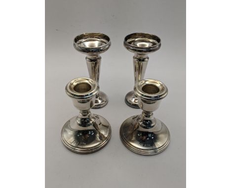 Silver compromising a pair of weighted vases and sward candlesticks.Location: 