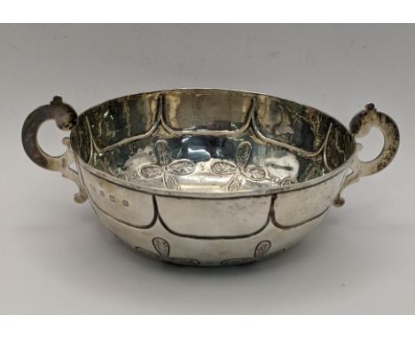 A silver embossed twin handled bowl hallmarked Birmingham 1912 total weight 119.5g 