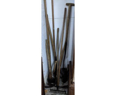 A group of vintage wooden handled garden tools to include an axe, rake, scythe and others Location: 