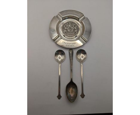 A silver commemorative plate and three silver spoons 198gLocation: 