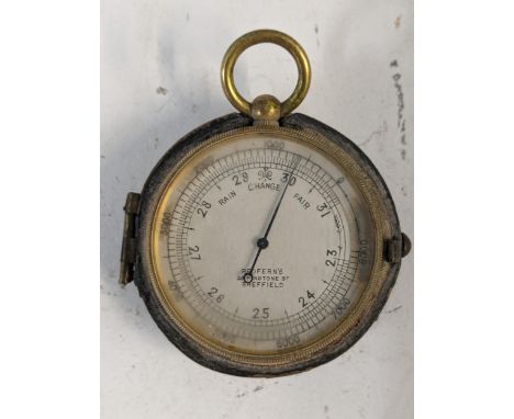 A Victorian brass cased pocket barometer, the dial marked 'Redfurn's 28 Pinstone Street Sheffield' Location: 