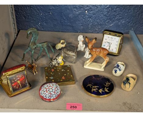 A mixed lot to include a millefiori paperweight, travel clocks, ceramic models to include cats, Etruscan style brass horse, w