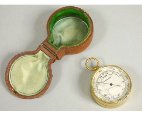 A brass compensated pocket barometer, the reverse with thermometer and compass, unsigned, double opening case, glass broken, 