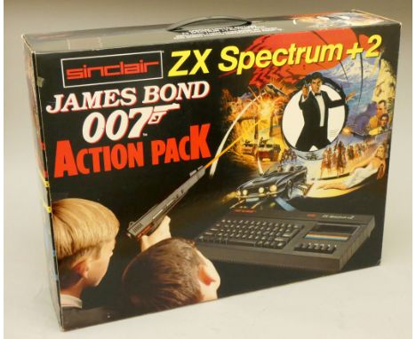 A boxed Sinclair ZX Spectrum +2 James Bond 007 Action pack, to include, power supply unit, light gun and joystick, user manua