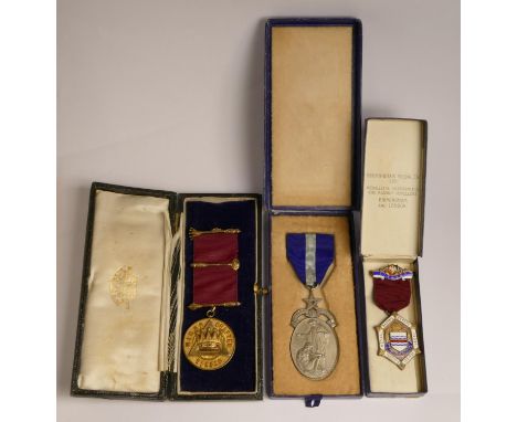 Three silver, silver gilt, silver gilt and enamel Masonic medals, cased, 98gm 