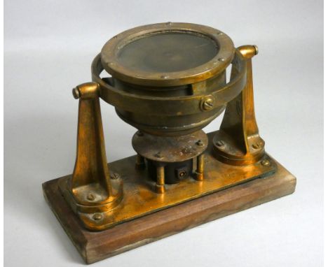 A brass ships 4" dial compass, the bezel stamped FORWARD, the gimbals stamped T.P, the stand stamped 41AA/49 and AFT, ht 19cm