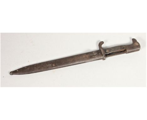 A German "sawback" bayonet, undated, stamped MOVE-WERK, 25cm blade, metal scabbard. 