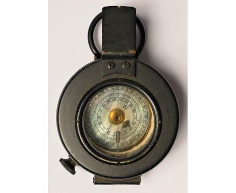 A WWII Mk III British Compass, by T.G. Co. Ltd. number B31235, broad arrow, dated 1940, box 