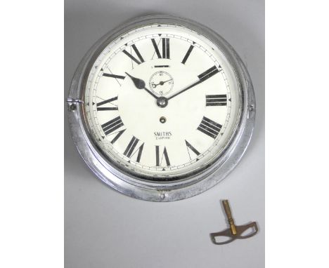 Smiths Empire chrome bulkhead clock, the 8" white enamel dial with Roman numerals and subsidiary seconds dial, the 7 jewel mo