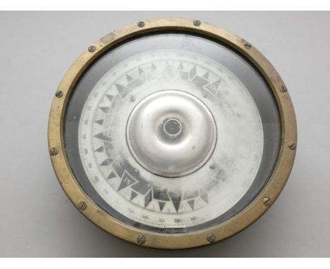 A brass mounted ships compass, dial worn, diameter 25cm. 