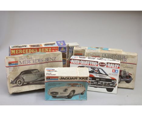Seven Automobile model kits, to include :Jaguar XKEAudi QuattroPackard Boat tail SpeedsterDuesenberg SJ RoadsterMercedes-Benz