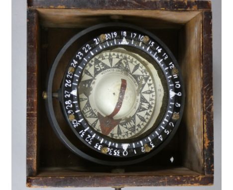 Dobbie McInnes &amp; Clyde Ltd, Glasgow, c.1921-37, a black 4" dial compass with gimbals, mounted in a wooden case, repainted