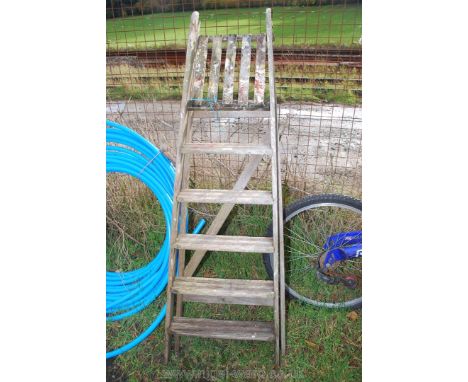 A six step wooden Step ladder.