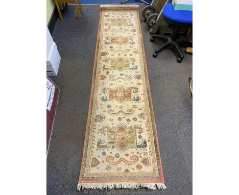 A cream ground Carpet Runner, 26½" x 106" approx.