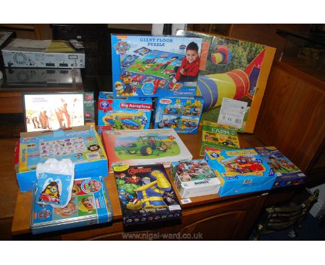 A box of children's games and puzzles including Paw Patrol Game and Giant Floor Puzzle, Thomas and Friends Ravensburger Puzzl