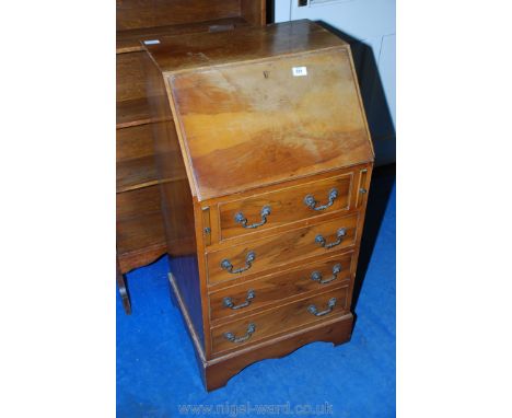 A compact four-drawer Yew wood bureau. 39" high, 20" wide and 18" deep. 