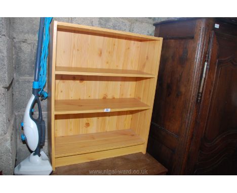 A Pine effect three-shelf display unit. 34'' high x 27'' wide x 10'' deep.