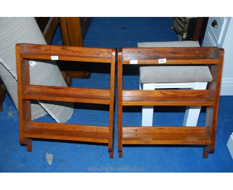 A pair of small pitch-pine, three-shelf, wall-hanging display shelves.