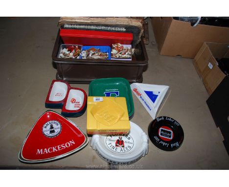 A quantity of ceramic pub ashtrays, cigar labels, etc.,