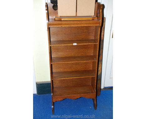 A five shelf Oak bookcase with pierced/fret-worked details of Arts &amp; Crafts design. 55'' high x 24'' x 7'' deep.