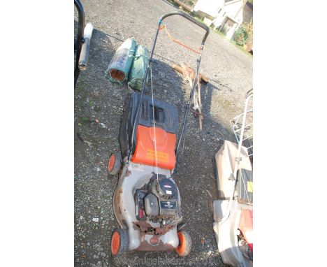 A Petrol rotary mower with Briggs &amp; Stratton engine, (pan a/f.).