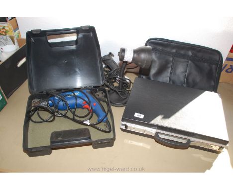 A cased "Draper" mains electric drill, a table lamp, a briefcase, etc.,