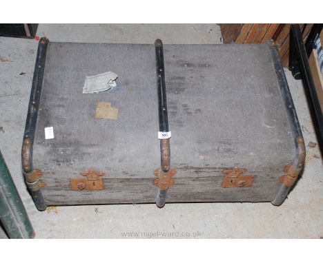 A bent-wood bound travel trunk.