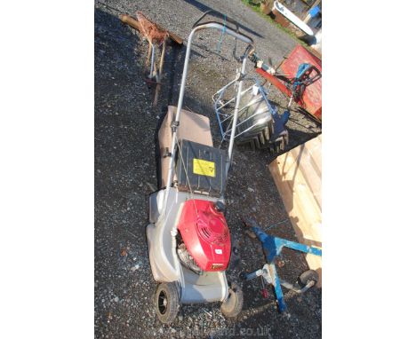 A Honda HR173 petrol rotary mower with self drive.