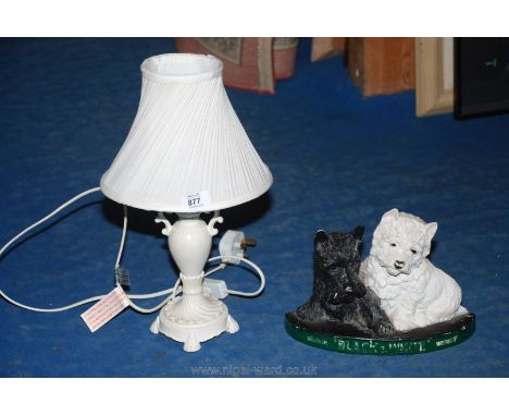 A "Black &amp; White Whisky" advertising type dog ornament and a table lamp with a cream/ white shade.