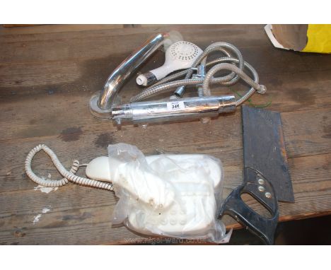 A shower mixer spray, a telephone, a saw and a handrail.