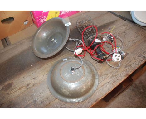 Two steel light reflectors and an inspection lamp