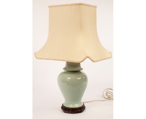 A Chinese style celadon lamp, 72cm high including shade CONDITION REPORT: Condition information is not usually provided in th