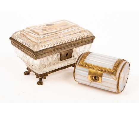 A mid 19th Century sarcophagus shaped glass box with gilded mounts and painted gilt flowers, 19cm wide and an opal coloured b