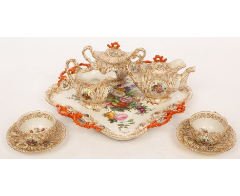 A Jacob Petit (Paris) porcelain tête-à-tête, circa 1840, each piece profusely moulded with irises and bulrushes, heightened i
