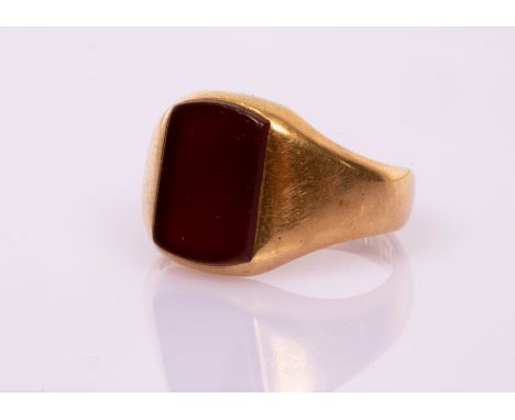 An 18ct yellow gold signet ring, James William Benson, London 1914, set with a carnelian plaque, size M½, gross weight approx