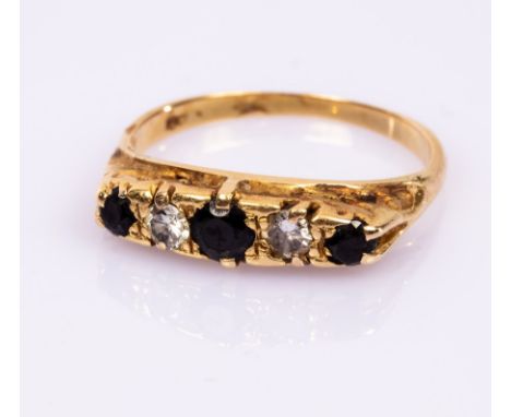 A sapphire and diamond five-stone ring, in an 18ct yellow gold scroll setting, size Q, approximately 3.9gm CONDITION REPORT: 