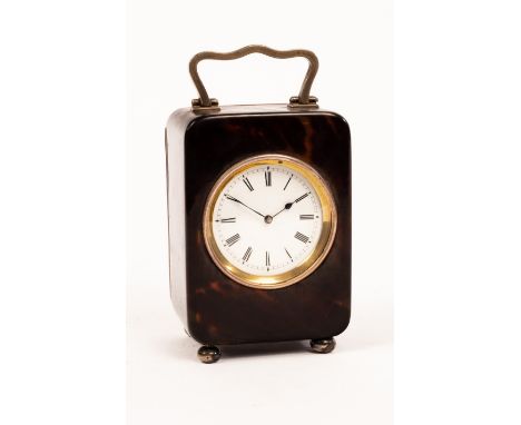 An Edwardian tortoiseshell cased clock, the silver handle and mounts William Comyns, London 1907, the white enamel dial with 