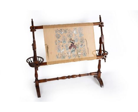 A stained beech tapestry loom with turned upright and spindle turned thread basket to each support, on splay feet, 118cm wide