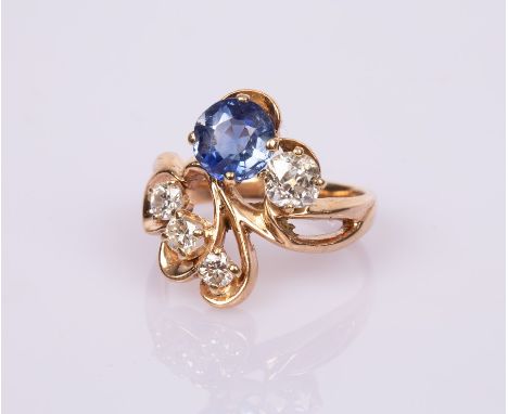 A sapphire and diamond dress ring, perhaps a bespoke commission, set with a circular sapphire and four diamonds in an unhallm