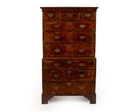 A George I walnut tallboy chest with moulded cornice, fitted three short and three long drawers, with three drawers to the ba