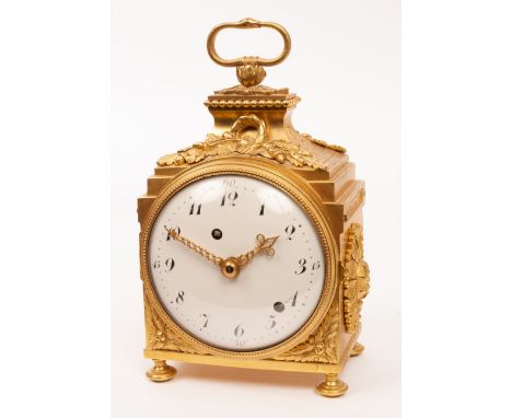 A late 19th Century French pendule d'officier eight-day clock, the case flanked by rosettes with snake handle on bun feet, fi