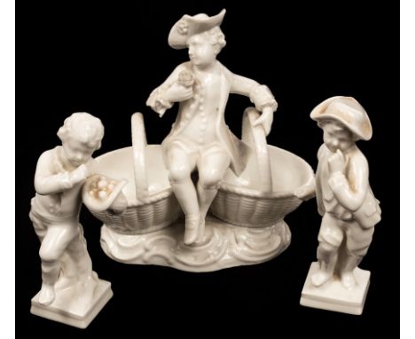A 19th Century Meissen figural salt and two Berlin figures with astrological symbols for Leo and Gemini, the first 13cm high 