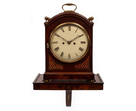 A Regency mahogany eight-day bracket clock, the circular white enamel dial with Roman numerals, striking on a bell, the arche