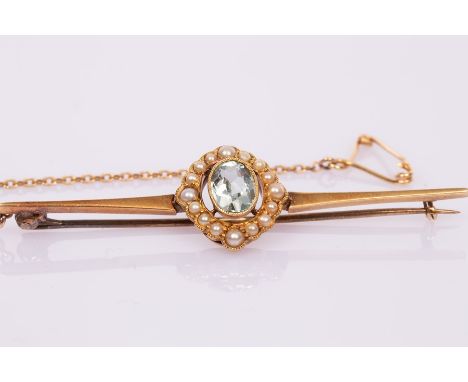 An Edwardian aquamarine and seed pearl bar brooch, set in 15ct gold, the brooch 6cm long/see illustration CONDITION REPORT: C