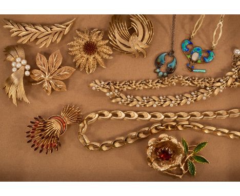 A quantity of costume jewellery by Trifari, comprising six brooches and two necklaces, two brooches by Sarah Coventry and two