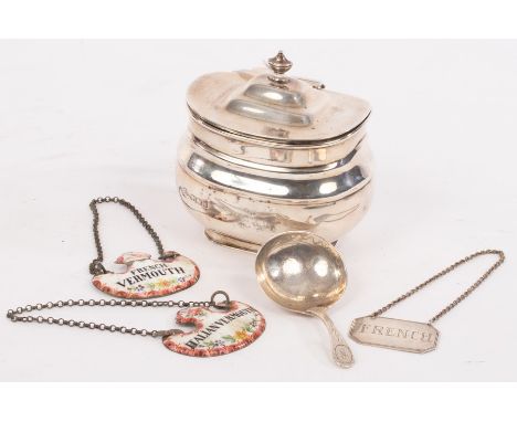 A silver tea caddy, Sheffield 1911, of rounded oblong form, 9cm wide, a caddy spoon, a wine label for French and two enamel w