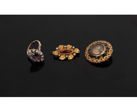 A paste set dress ring, the central purple stone to a surround of clear stones, size N½, a mourning brooch inscribed 'In Memo